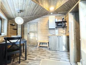 a kitchen with a table and a counter top at Panorama Iglu Hankasalmi Resort in Hankasalmi