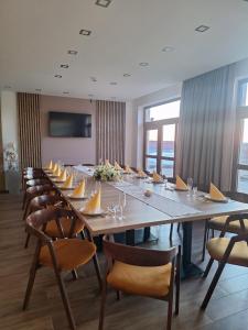 a large conference room with a long table and chairs at Wellness Penzión Vínny Dom in Streda nad Bodrogom +60 photos