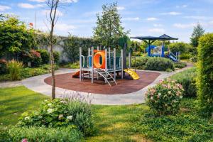 a playground in a garden with a park at Garden views in Juriquilla +2 photos