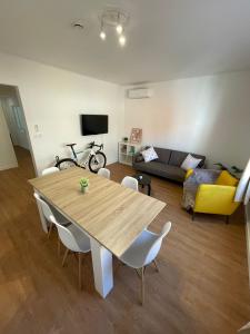 a living room with a table and a couch at Apartaments Montseny in Girona