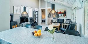 a living room with a table with fruit on it at VE400-Vejers-Strand-Engesovej-52 in Vejers Strand