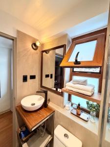 a bathroom with a sink and a mirror at Hm Montes Central in Cusco +66 photos