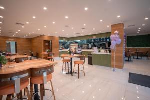 a restaurant with wooden tables and chairs and a counter at Sugar Bay Club in Frigate Bay