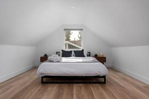 a bedroom with a large bed with white walls at Spacious w/ 2BR 1Bath - Big Bear in Big Bear City