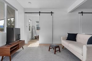a living room with a couch and a tv at Spacious w/ 2BR 1Bath - Big Bear in Big Bear City