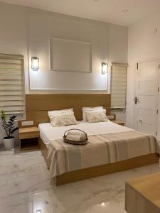 a bedroom with a bed with a bag on it at Trinity Villa Home Stay in Idukki