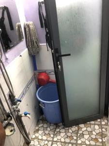 a door in a bathroom with a bucket at homestay Huynh DC in Ho Chi Minh City +43 photos
