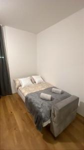 a bedroom with a large bed with two pillows at Aurora Apartment in Vienna