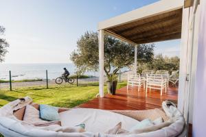 a living room with a view of the ocean at Mobile Homes Sunset Beach in Umag