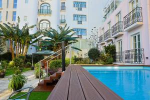 a swimming pool in front of a building at TM Luxury Apartments Lisbon in Lisbon