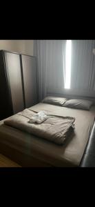 a bed in a bedroom with a blanket on it at Perfectly Located Airport Link Train City Access in Bangkok +14 photos