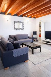 a living room with a couch and a coffee table at Casa di Cocco in Alzano Lombardo