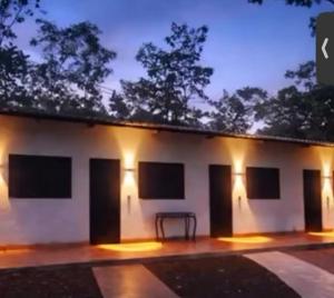 a building with lights on it at night at Casa do Lago Serra da Mesa - Niquelandia in Niquelândia