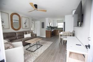 a living room with a couch and a table at The Dex at Coconut Cove in Fort Myers Beach