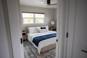 a bedroom with a bed and a window at The Dex at Coconut Cove in Fort Myers Beach +29 photos