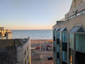 a view of the ocean from a building at Stunning Sea View 2BR Flat Sleeps 5 Walk to Beach - Big Savings for Extended Stays - by Nestora Stays Ltd in Brighton & Hove