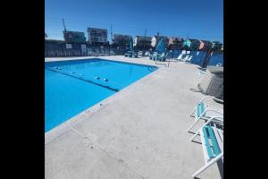 a swimming pool on the roof of a building at The Salty Camper in North Topsail Beach
