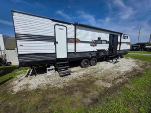 a large trailer is parked in a field at Catchin Rays in North Topsail Beach
