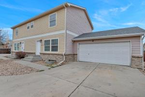 a large house with a white garage at Denver Retreat in Arvada