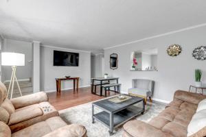 a living room with a couch and a table at Denver Retreat in Arvada