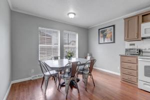 a kitchen with a dining room table and chairs at Denver Retreat in Arvada