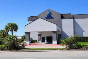 a building with a sign on the front of it at Best Western Cy-Fair in Houston
