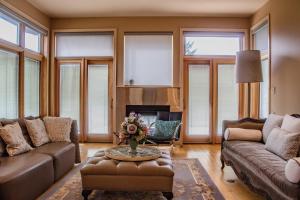 a living room with a couch and a table at Quiet Private Room with Ensuite - Broadmead 908 in Victoria