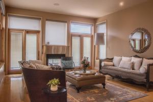 a living room with a couch and a fireplace at Quiet Private Room with Ensuite - Broadmead 908 in Victoria