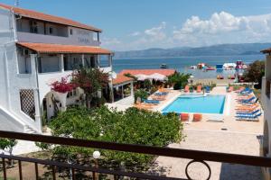 a view of a resort with a swimming pool at Sofia Beach Apartments in Kavos