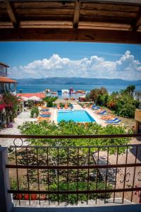 a view of a resort with a swimming pool at Sofia Beach Apartments in Kavos