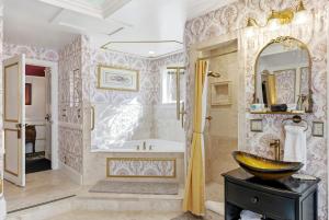 a bathroom with a tub and a sink at Heber Senator Bed and Breakfast in Heber City +33 photos