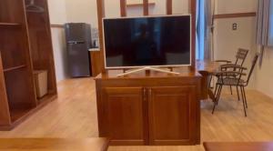 a flat screen tv sitting on top of a wooden entertainment center at Sao Biển Phú Quốc in Phú Quốc