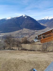 a view from the top of a hill with snow capped mountains at Hofschank Reinalterhof in Malles Venosta