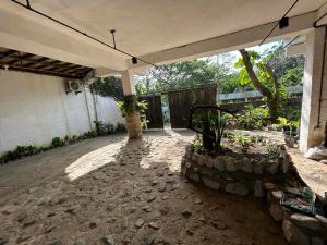 a patio of a house with a pavilion at Kuyas Tree House in Puerto Princesa City