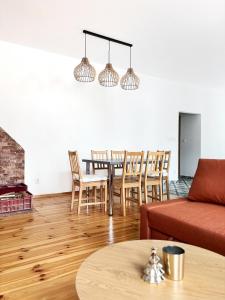 a living room with a table and chairs at Apartment Kundratice in Košťálov