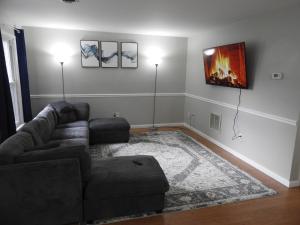a living room with a couch and a fireplace at CONDO 101c in Camp Hill +9 photos