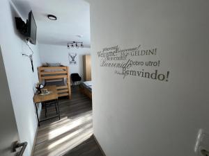 a room with a wall with writing on it at Gästehaus Luna in Rust
