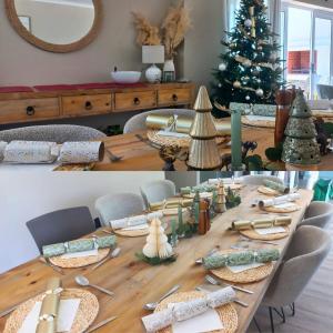 a table with a christmas tree in a room at Weekend at Bernies in Pringle Bay