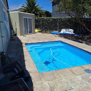 a small swimming pool with a basketball hoop in it at Weekend at Bernies in Pringle Bay