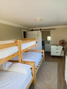 two bunk beds in a room with a bedroom at Weekend at Bernies in Pringle Bay