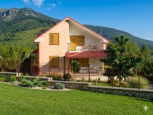 a house with a lawn in front of it at Entire Villa or Rooms! Spacious Villa in Nizepole Hiking, Peace, Private Events in Bitola