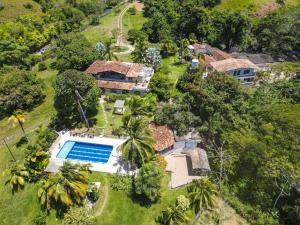 an aerial view of a house with a swimming pool at Amara Hotel in Doradal