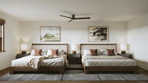a bedroom with two beds and a ceiling fan at Tributer Resort in Mineral