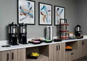 a counter with some food and drinks on it at Hyatt Studios Texarkana in Texarkana +12 photos