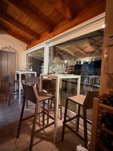 a dining room with a table and some chairs at GOLA Dimora storica in Cerignola
