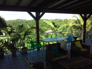 a patio with a table and chairs and a view at Bellevue Studios in Mare Gaillard