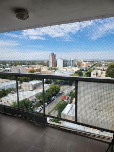 a view of a city from a large window at Apart Rucapel in General Roca +27 photos