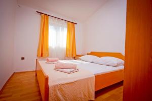Postel nebo postele na pokoji v ubytování Apartment Mara