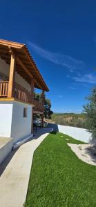 a patio of a house with green grass at Casa da Picoteira - Pool - Pets - EV Charger in Proença-a-Nova