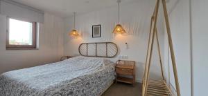 a bedroom with a bed and two lights at Casa da Picoteira - Pool - Pets - EV Charger in Proença-a-Nova +134 photos